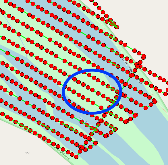 A grid of red circles with a blue circle around a group of red circles near the right middle edge